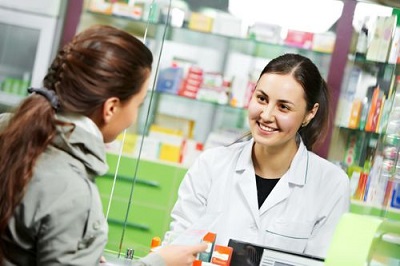 pharmacist smiling at her customer
