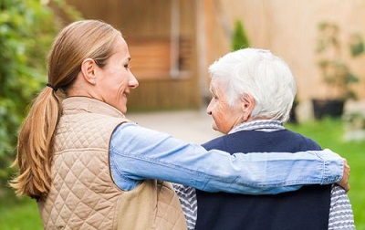 lady hugging a senior woman