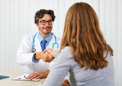 doctor shaking hands with his patient